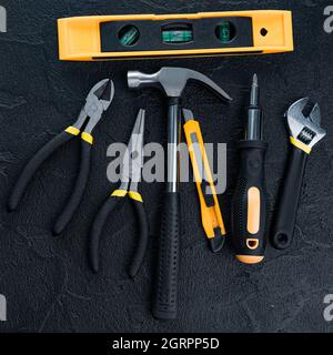 Many different tools for repair work on a black background Stock Photo