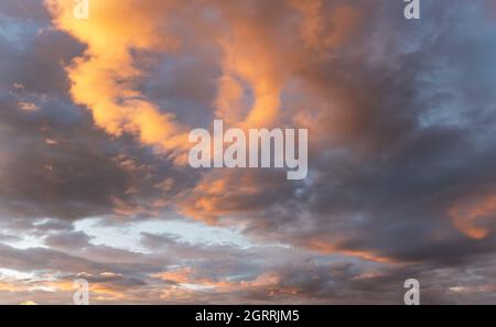 Orange afternoon sun lit on dark blue sunset sky, nature background Stock Photo