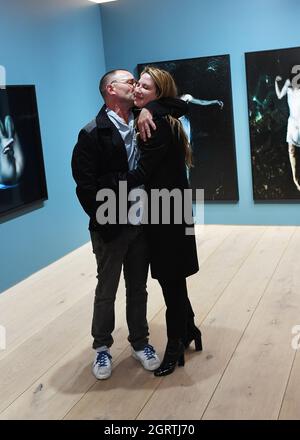 Munich, Germany. 01st Oct, 2021. Actor Thomas Kretschmann and his girlfriend Brittany Rice stand at the vernissage of his exhibition 'MUSE' at the Leica Gallery Munich. The series, which is on display until December 31, 2021, shows his girlfriend Brittany Rice underwater. Credit: Angelika Warmuth/dpa/Alamy Live News Stock Photo