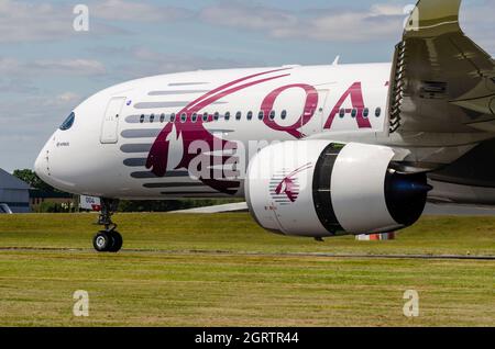 Airbus A350 jet airliner plane making the brand new type's public debut at Farnborough 2014 in Qatar livery. Using reverse thrust to stop on landing Stock Photo