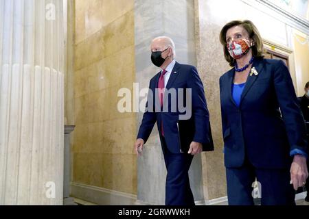 Washington DC, USA 01st Oct, 2021. U.S. House Speaker Nancy Pelosi escorts President Joe Biden to meet with the House Democratic Caucus about the $1 trillion infrastructure plan at the U.S. Capitol in Washington, DC on Friday, October 1, 2021. Photo by Chris Kleponis/UPI Credit: UPI/Alamy Live News Stock Photo