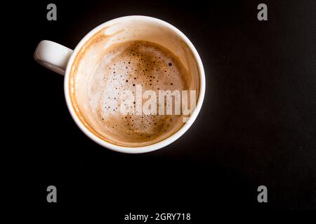 The Stain Of Hot Milk Coffee And Soft Froth Inside The White Ceramic Cup Half A Cup Of Coffee Stock Photo Alamy