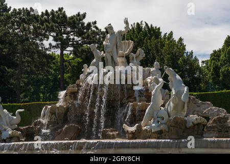 31 May 2019 - Vienna, Austria - Neptunbrunnen (Neptune fountain) at Schonbrunn palace. Sunny springtime day Stock Photo