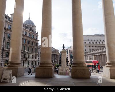 London, Greater London, England, September 21 2021: Looking out past the columns at the entrance to the Royal Exchange in the City of London. Stock Photo