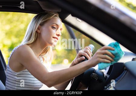 Premium Photo  Woman cleaning her car cockpit using spray and microfiber  cloth. cleaning the car, cleaning the interior of the car with a microfiber  cloth