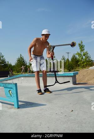 Dobrograd, Vladimir region, Russia. 29 July 2017. Teen with scooter in the skatepark Stock Photo