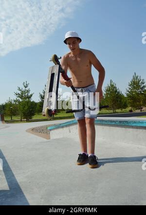 Dobrograd, Vladimir region, Russia. 29 July 2017. Teen with scooter in the skatepark Stock Photo