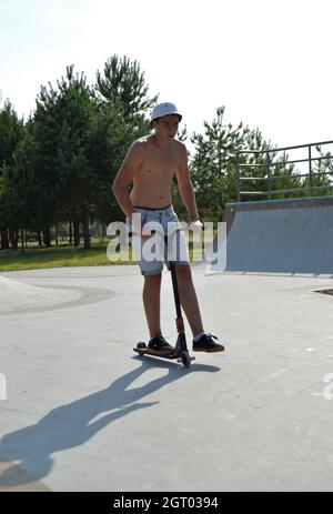 Dobrograd, Vladimir region, Russia. 29 July 2017. Teen on scooter in the skatepark Stock Photo