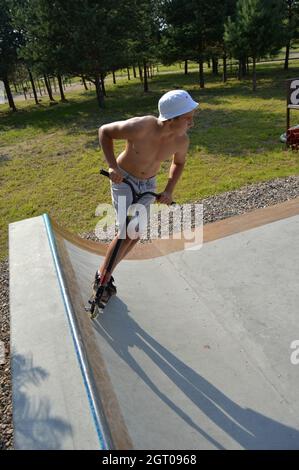 Dobrograd, Vladimir region, Russia. 29 July 2017. Teen on scooter in the skatepark Stock Photo