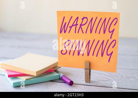 Text sign showing Warning Sinning. Business approach stop the action which is believed to break the laws Blank Sticky Note Laundry Clip Stack Of Stock Photo