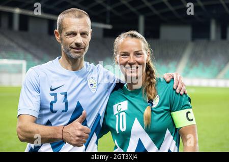 Ljubljana, Slovenia. 01st Oct, 2021. Aleksander Ceferin (L), President of The Union of European Football Associations and former top Slovenian Alpine skier Tina Maze (R) pose for a picture as captains of opposing teams after a charity football match in Ljubljana.Top former and recent Slovenian athletes, members of the Slovenian Olympic Team and former Slovenian and international soccer stars participated in a traditional charity football match in Ljubljana to raise funds for Sponsorship in Sport, an initiative helping young athletes from underprivileged backgrounds. The match is sponsored by A Stock Photo