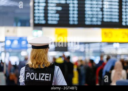 Langenhagen, Germany. 02nd Oct, 2021. A federal police officer stands in Terminal C at Hannover-Langenhagen Airport. Because the service provider commissioned by the Federal Police to carry out the handling checks has massive staffing problems, there have recently been long waiting times, with some travellers missing their flights as a result. Credit: Michael Matthey/dpa/Alamy Live News Stock Photo