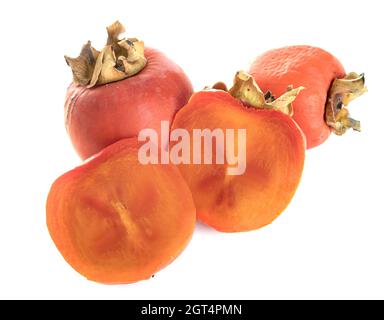 Close-up Of Persimmons Against White Background