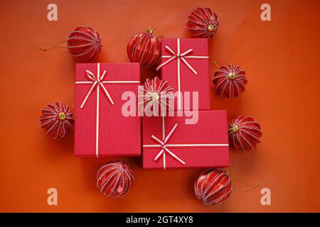 Cristmas presents.Merry Christmas. Surprises and gifts for the winter holidays. Red boxes set and red Christmas balls  Stock Photo