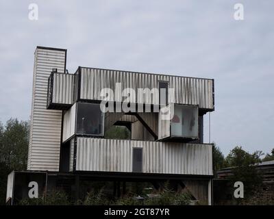 Stekene, Belgium, September 25, 2021, Stacked old shipping containers that serve as a residence Stock Photo