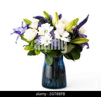 Funeral Bouquet purple White flowers, Sympathy and Condolence Concept on white background with copy space. Stock Photo