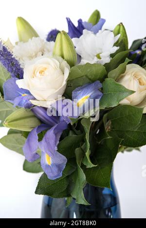 Funeral Bouquet purple White flowers, Sympathy and Condolence Concept on white background with copy space. Stock Photo