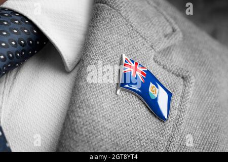 Metal badge with the flag of Anguilla on a suit lapel Stock Photo