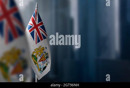 Small flags of British Antarctic Territory on a blurry background of the city Stock Photo