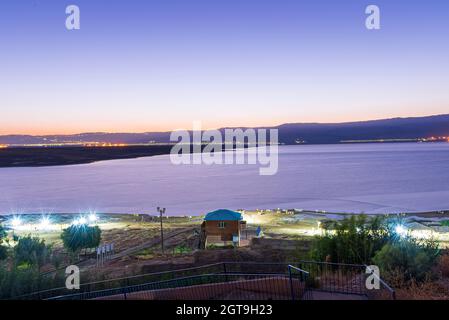 Sunrise over the Dead Sea on a foggy day. A view from Israel To Jordan Mountains. High quality photo Stock Photo