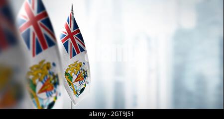 Small flags of British Antarctic Territory on a blurry background of the city Stock Photo