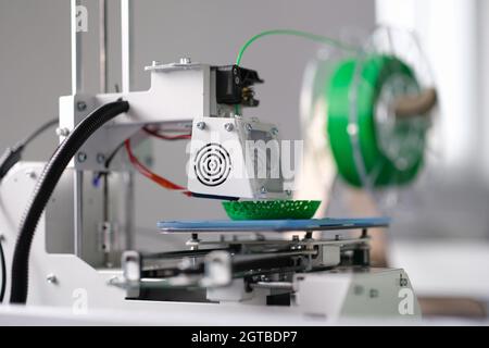 3D printing machine operation closeup. 3D rapid prototype processing Stock Photo