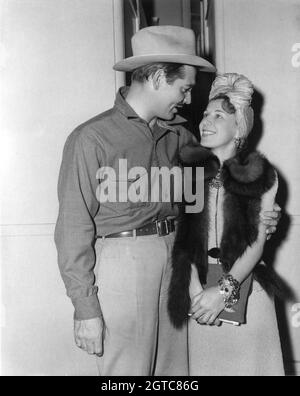 CLARK GABLE on set candid with Unidentified Female Visitor during filming of BOOM TOWN 1940 director JACK CONWAY screenplay John Lee Mahin based on a story by James Edward Grant gowns Gilbert Adrian music Franz Waxman Metro Goldwyn Mayer Stock Photo