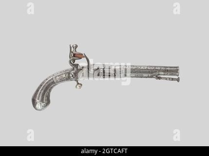 Vertical shot of an old metal gun on white background Stock Photo