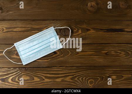 Medical Protective, Blue Face Mask, On Wooden Background, Closeup, Flat Lay, Copy Space