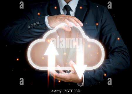 Cloud computing and technology concept. Palm hands of Businessman holding icon cloud computing network and data information. Massive storage for accom Stock Photo