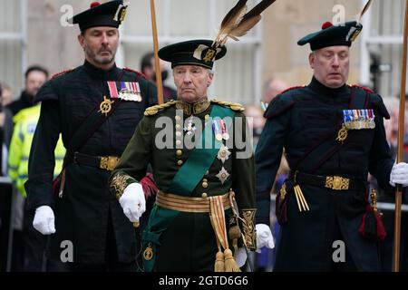Richard Scott the 10th Duke of Buccleuch (centre) arrives at the Scottish Parliament in Edinburgh, ahead of Queen Elizabeth II who will deliver a speech in the debating chamber, to mark the official start of the sixth session of Parliament. Picture date: Saturday October 2, 2021. Stock Photo
