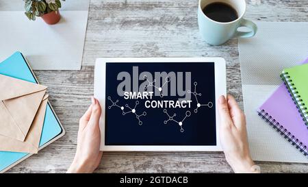 Smart contract blockchain based technology concept on screen. Cryptocurrency, Bitcoin and ethereum. Stock Photo