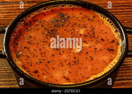 Extreme closeup of tasty soup in steel pot served in armenian restaurant Stock Photo