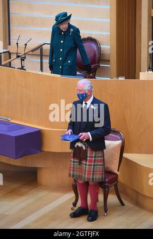 The Prince of Wales, known as the Duke of Rothesay when in Scotland, stands as his mother, Queen Elizabeth II, prepares to deliver a speech in the debating chamber of the Scottish Parliament in Edinburgh to mark the official start of the sixth session of Parliament. Picture date: Saturday October 2, 2021. Stock Photo