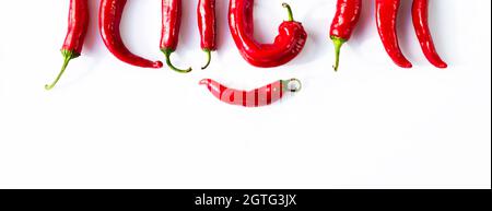Frame for text from red hot peppers on a white background. Square. Stock Photo