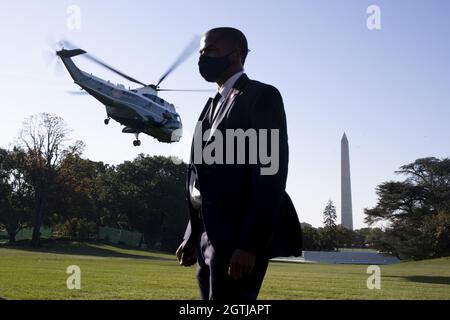 A member of the US Secret Service stands on the South Lawn of the White House as Marine One departs with US President Joe Biden in Washington, DC, on Saturday, October, 2, 2021.  Biden travels to Wilmington, Delaware for the weekend.   Photo by Michael Reynolds/UPI Stock Photo