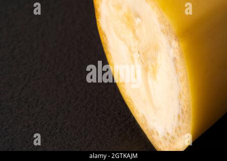 Macro Fruit: Ripe banana extreme close-up, horizontal format, black background Stock Photo