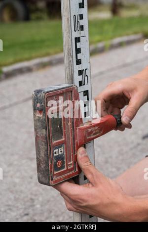 Measurement Technology For Measuring A Property - Construction Workers Stock Photo
