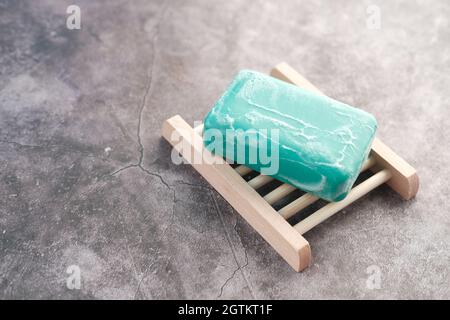 Soap and bubbles on a case on black background  Stock Photo