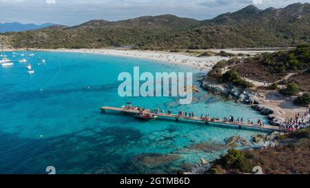 Aerial view of Loto Beach in the Agriates Desert northwest of Saint Florent near the Cap Corse, Corsica, France -Leisure boats moored in azure waters Stock Photo