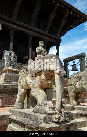 Stone elephants guard the entrance to the Uma Maheshwar temple in Kirtipur in the Kathmandu Valley, Nepal. Stock Photo