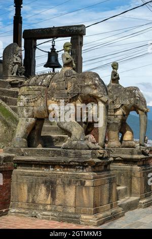 Stone elephants guard the entrance to the Uma Maheshwar temple in Kirtipur in the Kathmandu Valley, Nepal. Stock Photo