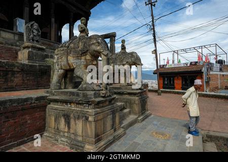 Kirtipur, Nepal - October 2021: Stone elephants guard the entrance to the Uma Maheshwar temple on October 2, 2021 in Kirtipur, Kathmandu Valley, Nepal Stock Photo