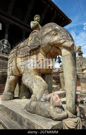 Stone elephants guard the entrance to the Uma Maheshwar temple in Kirtipur in the Kathmandu Valley, Nepal. Stock Photo