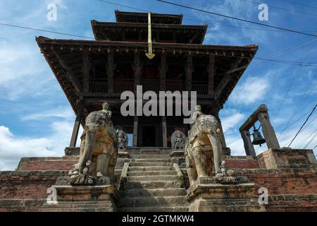 Stone elephants guard the entrance to the Uma Maheshwar temple in Kirtipur in the Kathmandu Valley, Nepal. Stock Photo