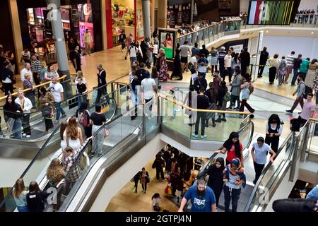 Inside Birmingham Bullring shopping centre with crowds of customers on two floors, UK Stock Photo