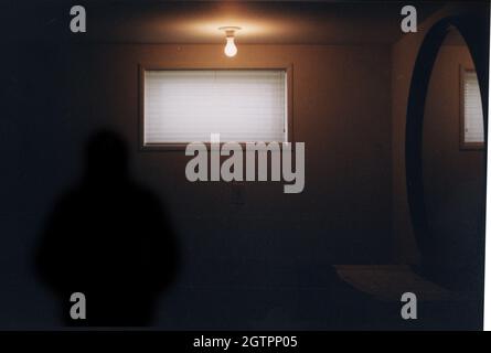 Mysterious shadow in spooky room. 3D rendering. Stock Photo