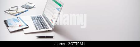 Analyst works with the data. Graphs on the screen Stock Photo