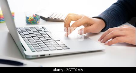 Woman using laptop, online shopping concept, close up Stock Photo