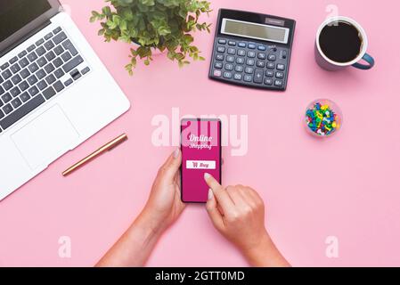 Woman using mobile app, online shopping concept, flat lay Stock Photo